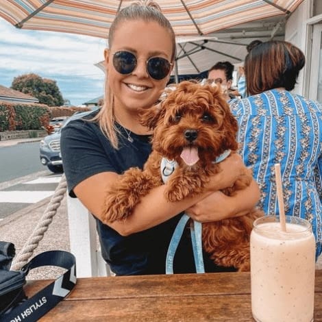 Woman and dog dine together at Melbourne's dog friendly cafe