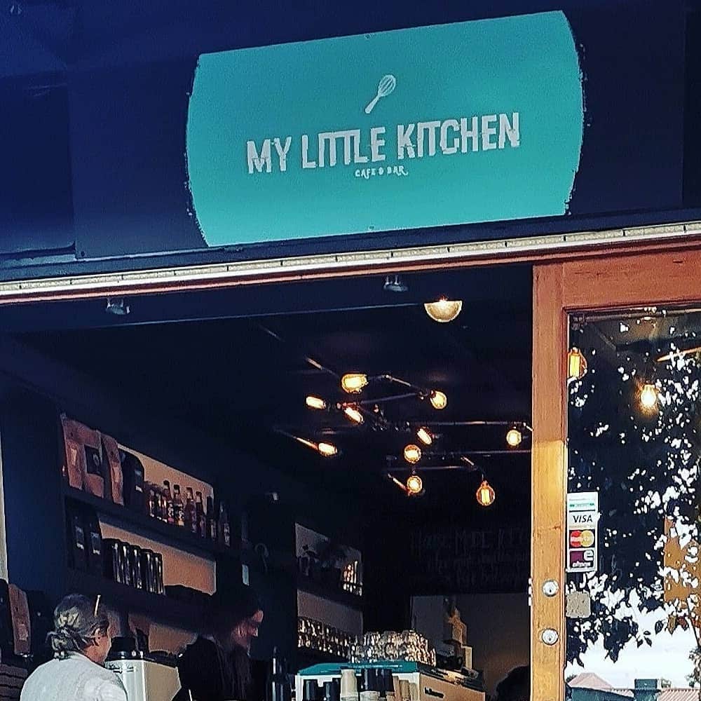 The front of the pet friendly restaurant in Melbourne where the logo is seen and an interior view