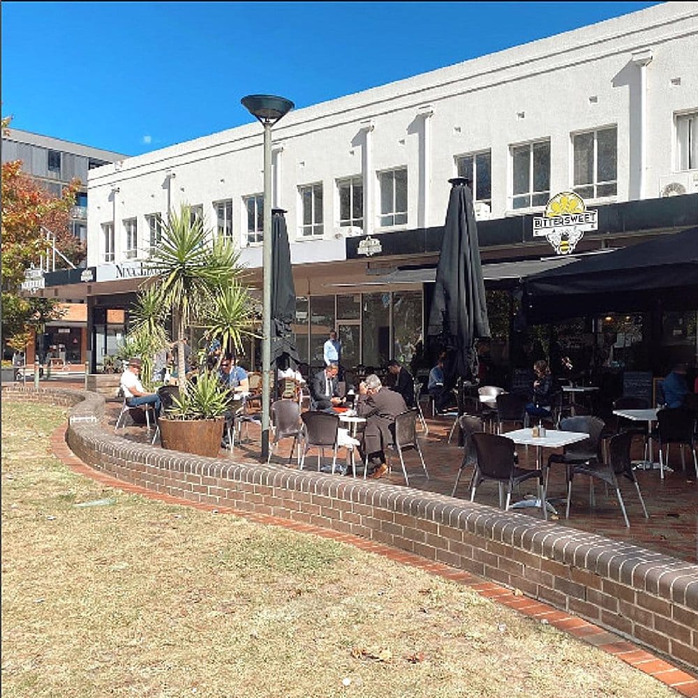 A dog friendly cafe in Canberra featuring its outdoor seating area filled with patrons and guests