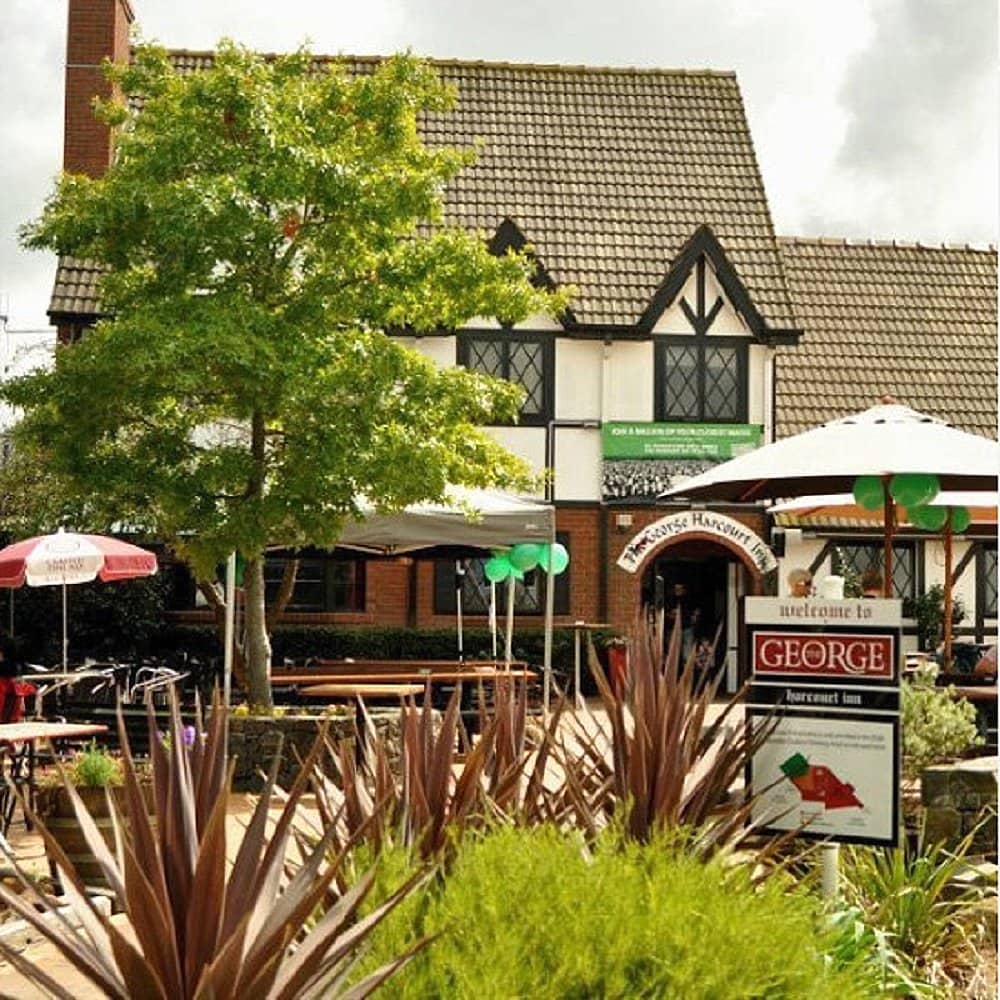 A view of The George Harcourt Inn in Canberra with the outdoor tables and chairs on display