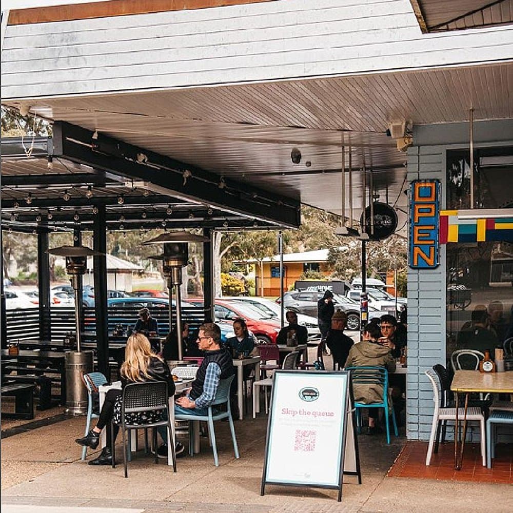 Little Oink, a cafe in Canberra showing the full view of the outdoor seating of the place